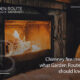 Lit Fire in a fireplace with a flammable warm fur rug directly in front of it.